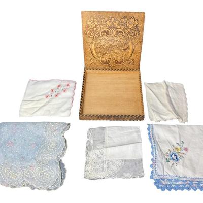 Sale Photo Thumbnail #597: This piece is pyrography scrolled and ornately decorated with an Art Nouveau motif. It is beautifully decorated with red and light green shading on the surface. There is a warp of the lid, but the hinge works correctly. Also includes five vintage handkerc