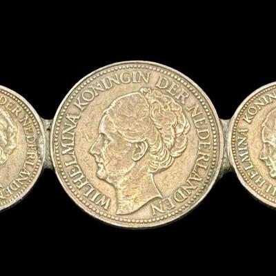 Sale Photo Thumbnail #606: [9.20g] This piece features three coins, mounted on a pin. The pin appears to have been replaced, and the piece may or may not be complete. The weight is overall. Silver content confirmed using Niton XRF precious metals analyzer. Measurement: 1 7/8”L. [