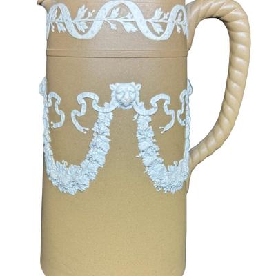 Sale Photo Thumbnail #608: Dudson was a 19th century competitor of Wedgwood. This is unglazed stoneware with applied white neoclassical reliefs. There is one small chip on the base. Measurement: 8”H x 5.5”W at base. Pre-auction estimate: $25-$50. [BK]