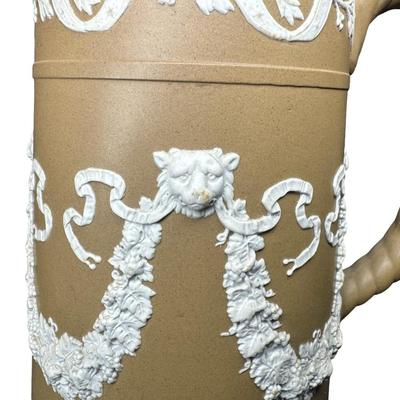 Sale Photo Thumbnail #610: Dudson was a 19th century competitor of Wedgwood. This is unglazed stoneware with applied white neoclassical reliefs. There is one small chip on the base. Measurement: 8”H x 5.5”W at base. Pre-auction estimate: $25-$50. [BK]