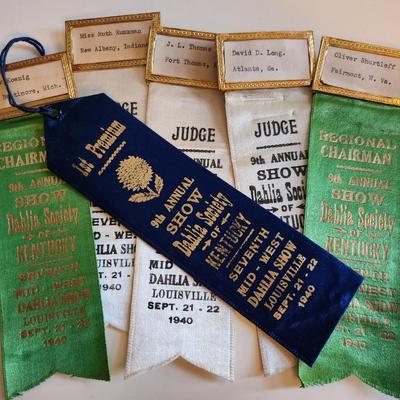 Sale Photo Thumbnail #236: This lot is for a grouping of Vintage Dahlia Society Show Ribbons. The judges worn these as they chose their blue ribbon winners.  Nice collection of items from the 1940s.  There are six ribbons in the lot. Great from many uses.  Where you gonna find 'em.