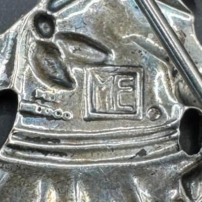 Sale Photo Thumbnail #619: [20.67g] Includes a black onyx and marcasite brooch, a brooch made in Mexico that depicts a young girl, and more. Total of three pieces. Measurement of longest: 3.5”L. Silver content confirmed using Niton XRF precious metals analyzer. [BK]