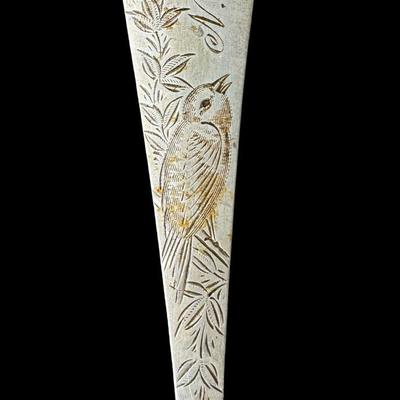Sale Photo Thumbnail #623: [31.13g] This fork is marked “N. Matson & Co,” which is the retailer, and is believed to be made by Gorham, in the “Nightingale” pattern, circa 1880s. It is characterized by delicate engraving, featuring a bird among floral/vine elements. It is mo