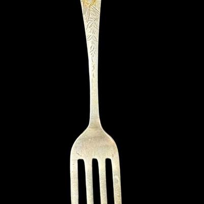Sale Photo Thumbnail #622: [31.13g] This fork is marked “N. Matson & Co,” which is the retailer, and is believed to be made by Gorham, in the “Nightingale” pattern, circa 1880s. It is characterized by delicate engraving, featuring a bird among floral/vine elements. It is mo