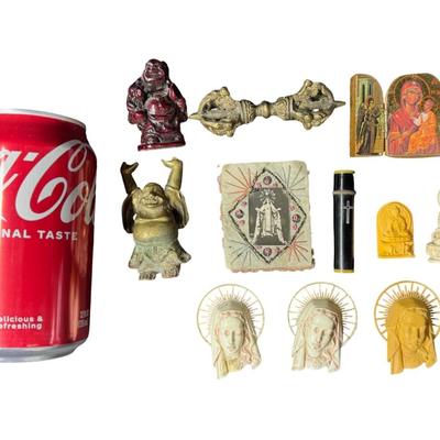Sale Photo Thumbnail #626: Includes a resin Buddha, a brass Buddha, Virgin Mary icons, a tri-fold Orthodox plaque, and more. Total of ten pieces. Measurement of longest: 3.5”L. [BK]