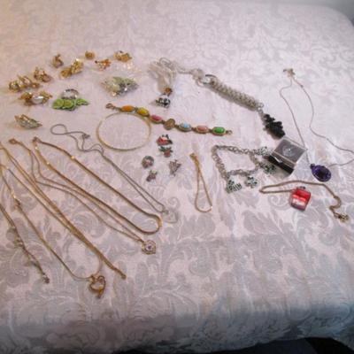Sale Photo Thumbnail #38: Necklaces, bracelets, charms, keychains, clip earrings. See pictures