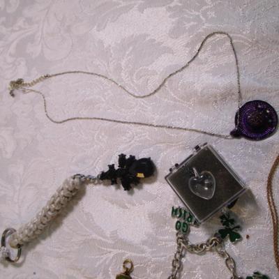 Sale Photo Thumbnail #47: Necklaces, bracelets, charms, keychains, clip earrings. See pictures