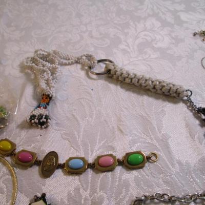 Sale Photo Thumbnail #43: Necklaces, bracelets, charms, keychains, clip earrings. See pictures