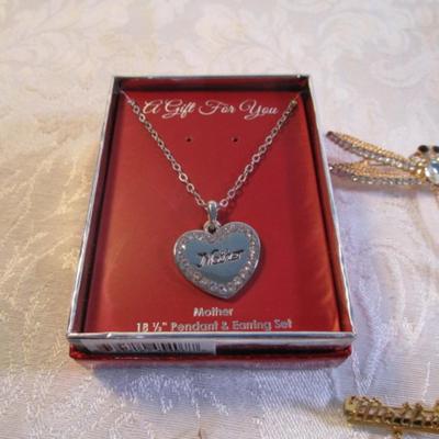 Sale Photo Thumbnail #56: Vintage broaches, pins, necklaces, bracelet, clip earrings. See pictures