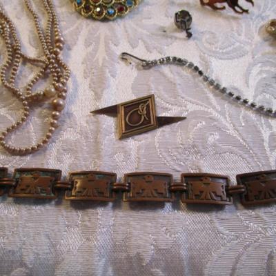 Sale Photo Thumbnail #50: Vintage broaches, pins, necklaces, bracelet, clip earrings. See pictures