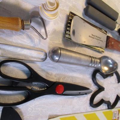 Sale Photo Thumbnail #129: adjustable measuring spoon, spatulasr, measuring spoons, whip, jar openers, pancake forms, can opener, kitchen scissors, peeler, ice cream scoops, ice pick, bottle openers, gas line wrench, tupperware labels, knife, bear trive