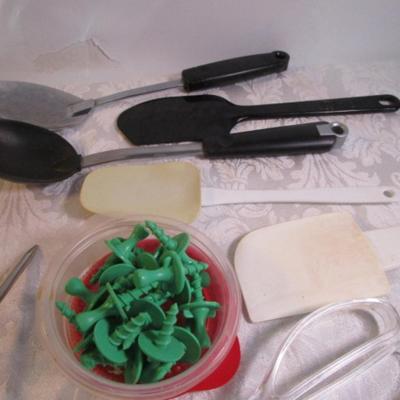 Sale Photo Thumbnail #140: Corn cob holders, new meat thermometer, pizza cutter, can opener, measuring spoons, nut cracker & picks, baster, spatula, 6 serving spoons, tongs, ladle, bottle openers, ice pick, bottle opener, watermelon slicer, tupperware cleaner, rubber spatulas