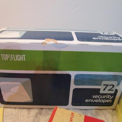 Sale Photo Thumbnail #550: 7 yellow 5" x 7" legal pads 3 Post-it 4" x 6" lined pads, 2 boxes of staples, 1 box 3.62" x 6.5" security envelopes, 2 pkg (100 ea) plus 66 loose 4" x 6"  index  cards, 2 rolls shipping tape, 3 pkg index dividers, ruler, clipboard, wirebound notebook