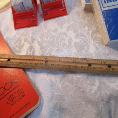 Sale Photo Thumbnail #555: 7 yellow 5" x 7" legal pads 3 Post-it 4" x 6" lined pads, 2 boxes of staples, 1 box 3.62" x 6.5" security envelopes, 2 pkg (100 ea) plus 66 loose 4" x 6"  index  cards, 2 rolls shipping tape, 3 pkg index dividers, ruler, clipboard, wirebound notebook