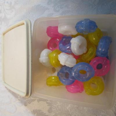 Sale Photo Thumbnail #598: 24 silicone cupcake bakers, box of 100 paper cupcake liners, 9 green and 7 red sundae dishes, multi-function grater, sink strainer, 25 plastic ice cubes inn a plastic lid with lid, 1 8" white plate, 1 new set of 3 funnels, 1 Tupperware funnel, 1 big funne