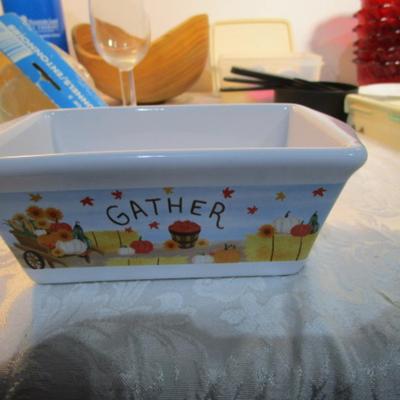 Sale Photo Thumbnail #586: 24 silicone cupcake bakers, box of 100 paper cupcake liners, 9 green and 7 red sundae dishes, multi-function grater, sink strainer, 25 plastic ice cubes inn a plastic lid with lid, 1 8" white plate, 1 new set of 3 funnels, 1 Tupperware funnel, 1 big funne