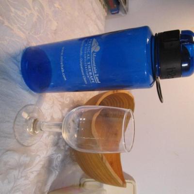 Sale Photo Thumbnail #590: 24 silicone cupcake bakers, box of 100 paper cupcake liners, 9 green and 7 red sundae dishes, multi-function grater, sink strainer, 25 plastic ice cubes inn a plastic lid with lid, 1 8" white plate, 1 new set of 3 funnels, 1 Tupperware funnel, 1 big funne