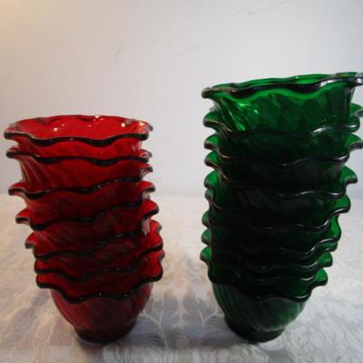 Sale Photo Thumbnail #601: 24 silicone cupcake bakers, box of 100 paper cupcake liners, 9 green and 7 red sundae dishes, multi-function grater, sink strainer, 25 plastic ice cubes inn a plastic lid with lid, 1 8" white plate, 1 new set of 3 funnels, 1 Tupperware funnel, 1 big funne