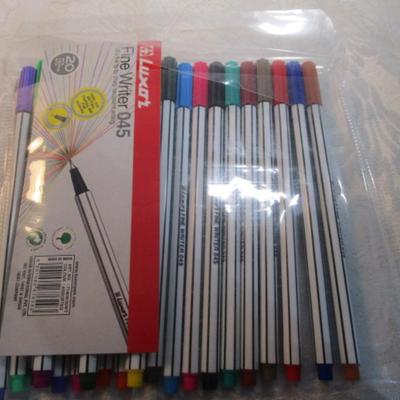 Sale Photo Thumbnail #611: 1 hinge-lid plastic container, stationery kit, greeting cards & Christmas cards, 2 new pkg Acrylic gems (blue & red), teal glass gems, 6' measuring tape, compass, 20 fine markers, 2 pens, container of safety pins