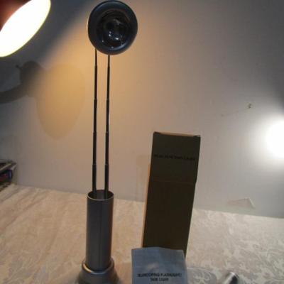 Sale Photo Thumbnail #738: Telescoping flashlight is a dual function flashlight & takes 2 C batteries not included, see pictures