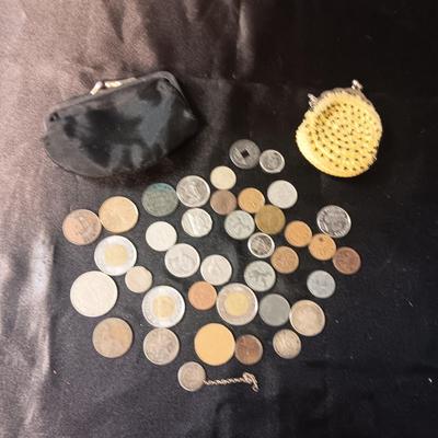 A COLLECTION OF MOSTLY FOREIGN COINS AND 2 OLD COIN PURSES