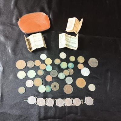 FOREIGN COINS AND PAPER CURRENCY PLUS A LEATHER COIN PURSE