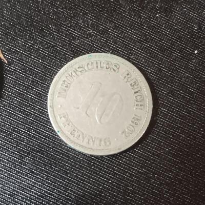 FOREIGN COINS AND PAPER CURRENCY PLUS A LEATHER COIN PURSE