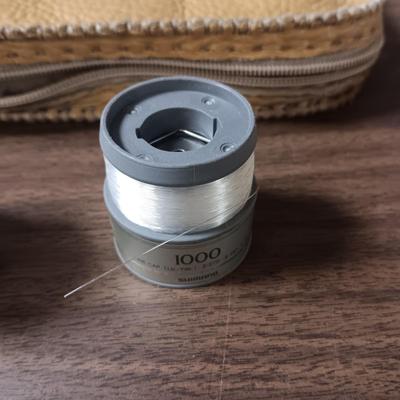 SHORT KUTT POCKET SAW, SPINNING REEL SPOOL, FISHING FLIES BOOK AND MORE