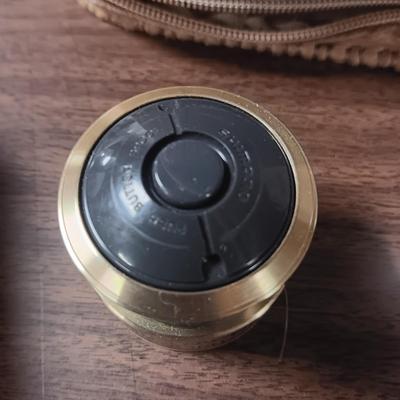 SHORT KUTT POCKET SAW, SPINNING REEL SPOOL, FISHING FLIES BOOK AND MORE