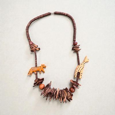 Sale Photo Thumbnail #18: Vintage Hand Carved Wooden Safari Animal Necklace.  This necklace is crafted from various woods and shell
Overall Length 30"