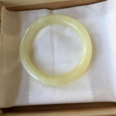 Sale Photo Thumbnail #232: Natural pale yellow-green bangle 
2.5 inch interior diameter