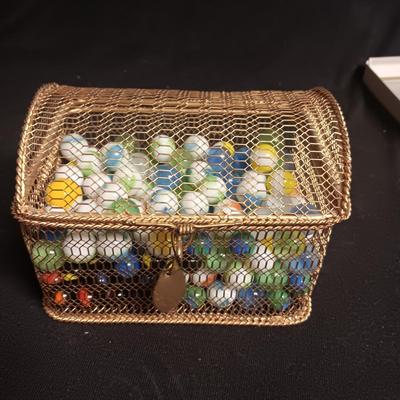 METAL HINGED BOX FULL OF MISC MARBLES
