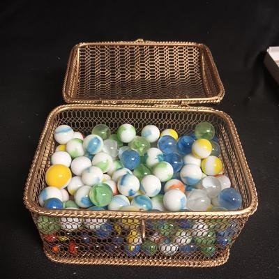 METAL HINGED BOX FULL OF MISC MARBLES