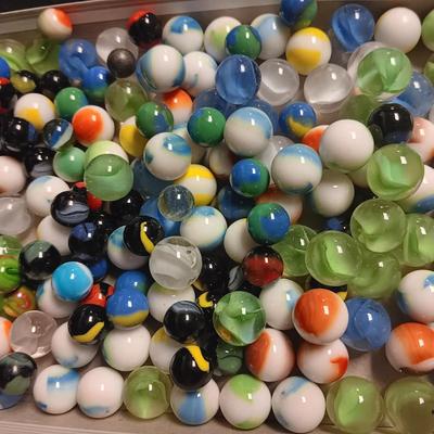 METAL HINGED BOX FULL OF MISC MARBLES