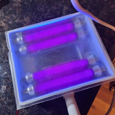 Sale Photo Thumbnail #430: As pictured,  I believe it's to see skin issues but has a multitude of uses. See photos, one edge of cover is broken but it still stays on