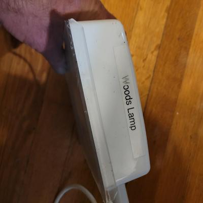 Sale Photo Thumbnail #433: As pictured,  I believe it's to see skin issues but has a multitude of uses. See photos, one edge of cover is broken but it still stays on