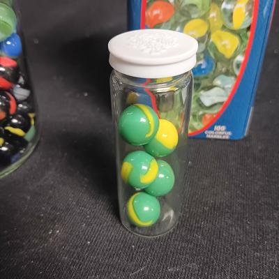 100 COLORFUL MARBLES IN A TIN AND A JAR OF MARBLES