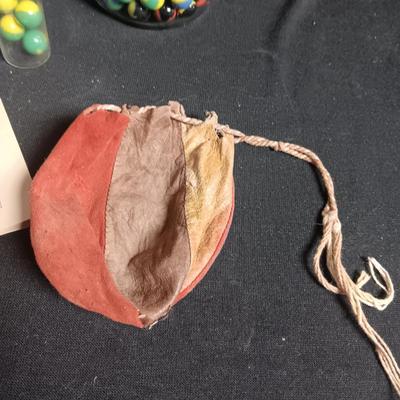 100 COLORFUL MARBLES IN A TIN AND A JAR OF MARBLES