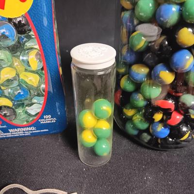 100 COLORFUL MARBLES IN A TIN AND A JAR OF MARBLES