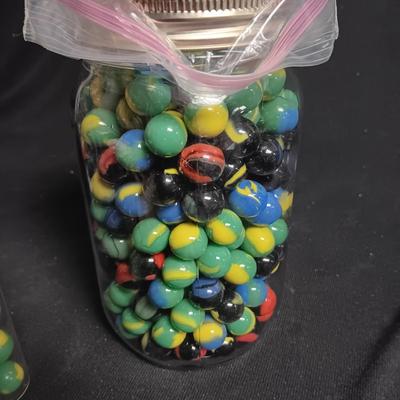 100 COLORFUL MARBLES IN A TIN AND A JAR OF MARBLES