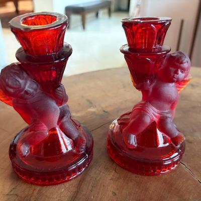 Pair of ruby red glass cherub candleholders