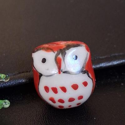 Sale Photo Thumbnail #107: Blown glass fishy & gorgeous hand created owl. Both are adorable & about the size of a penny, as shown