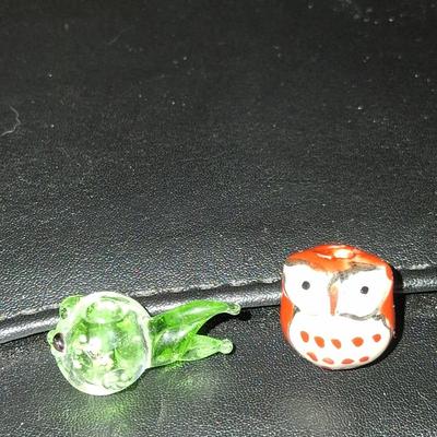 Sale Photo Thumbnail #104: Blown glass fishy & gorgeous hand created owl. Both are adorable & about the size of a penny, as shown