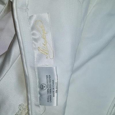 Sale Photo Thumbnail #134: Size 8 two piece gown. Dress with removable train. Gorgeous,  preserved after 1 wear & in excellent condition.  Michelangelo Gown, original price $2999

You can make arrangements to come in & try gowns on. Please message for appointments