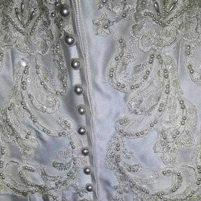 Sale Photo Thumbnail #139: Size 8 two piece gown. Dress with removable train. Gorgeous,  preserved after 1 wear & in excellent condition.  Michelangelo Gown, original price $2999

You can make arrangements to come in & try gowns on. Please message for appointments