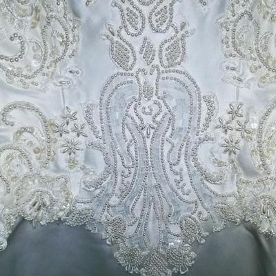 Sale Photo Thumbnail #141: Size 8 two piece gown. Dress with removable train. Gorgeous,  preserved after 1 wear & in excellent condition.  Michelangelo Gown, original price $2999

You can make arrangements to come in & try gowns on. Please message for appointments