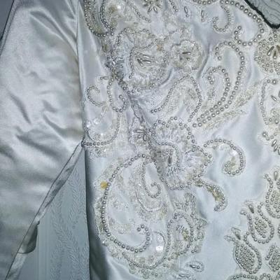 Sale Photo Thumbnail #151: Size 8 two piece gown. Dress with removable train. Gorgeous,  preserved after 1 wear & in excellent condition.  Michelangelo Gown, original price $2999

You can make arrangements to come in & try gowns on. Please message for appointments