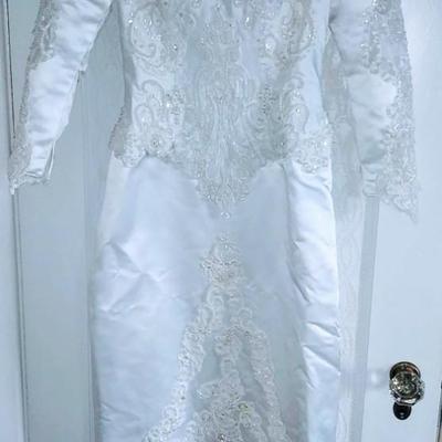 Sale Photo Thumbnail #142: Size 8 two piece gown. Dress with removable train. Gorgeous,  preserved after 1 wear & in excellent condition.  Michelangelo Gown, original price $2999

You can make arrangements to come in & try gowns on. Please message for appointments