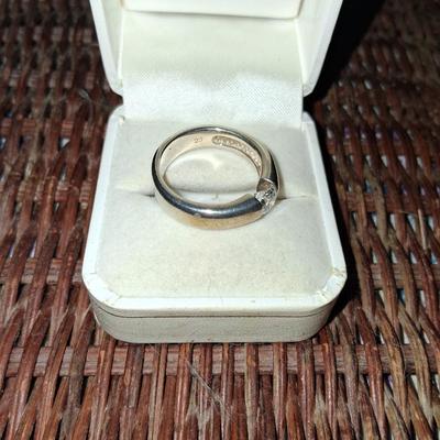 Sale Photo Thumbnail #162: Size 8 1/2 (approximately) Excellent condition 

Stone is held in the ring by the tension of the 2 sides. It is a near perfect Cubic Zirconia in Gold washed Sterling Silver. This is a fantastic hard to find ring.