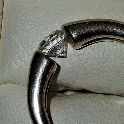 Sale Photo Thumbnail #160: Size 8 1/2 (approximately) Excellent condition 

Stone is held in the ring by the tension of the 2 sides. It is a near perfect Cubic Zirconia in Gold washed Sterling Silver. This is a fantastic hard to find ring.